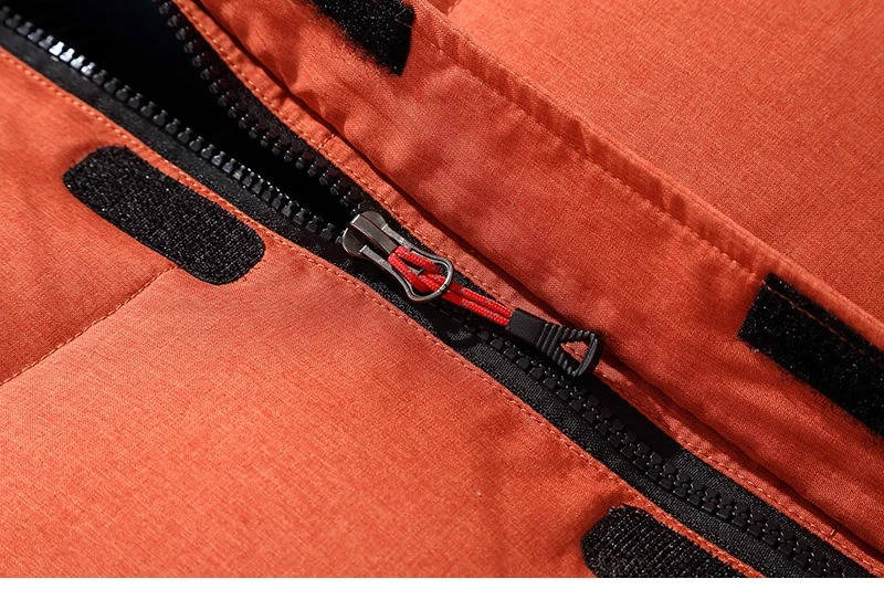 Insulated winter parka side view showing the hip-length waterproof shell.