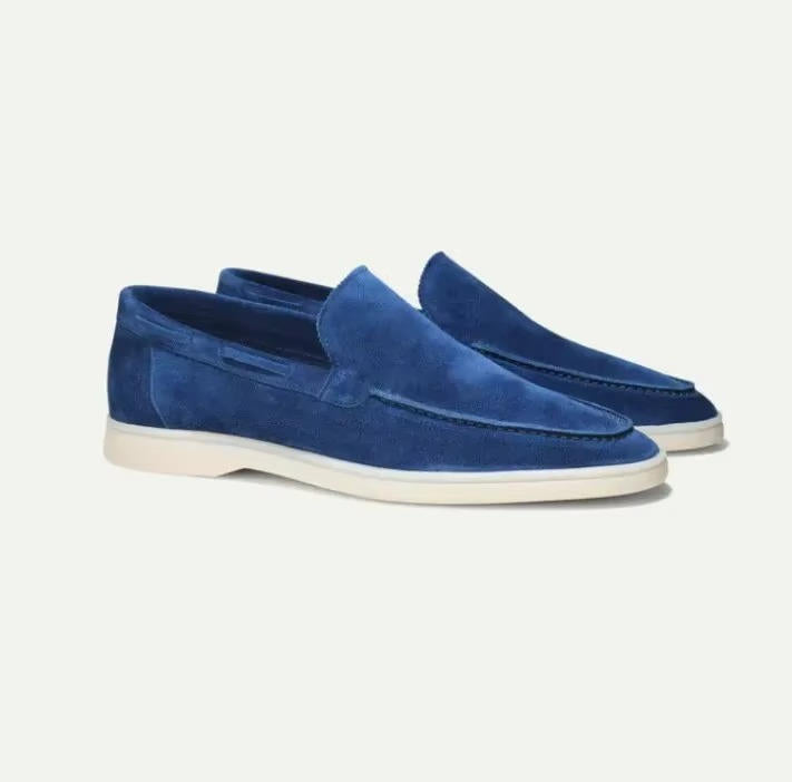 Suede yacht loafers in sky blue, slip-on style with a padded collar, side view.