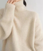 Soft knit turtleneck sweater back view showing the loose silhouette