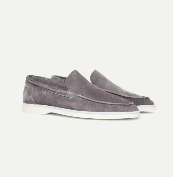 Suede yacht loafers in gray, slip-on style with a non-slip yacht sole, side view.