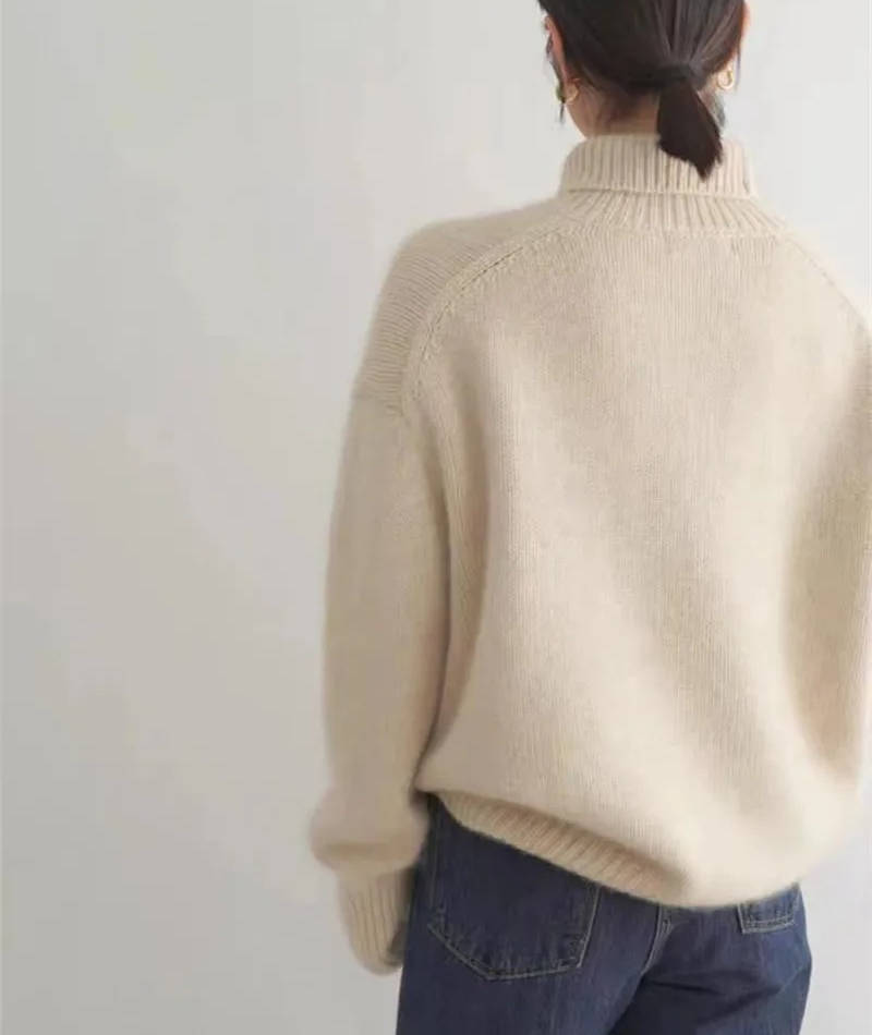 Soft knit turtleneck sweater ribbed hem detail