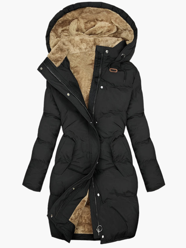 Green hooded quilted coat shown worn, longline silhouette with side pockets