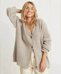 Beige soft knit cardigan with V-neck and button front, relaxed fit layering piece