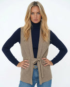 Belted sleeveless knit vest in camel.