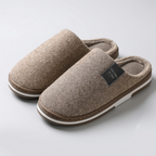 Brown slippers, soft lining and sturdy sole, studio front view