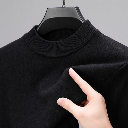 Soft knit sweater pullover in black with a regular fit and straight hem, front view.