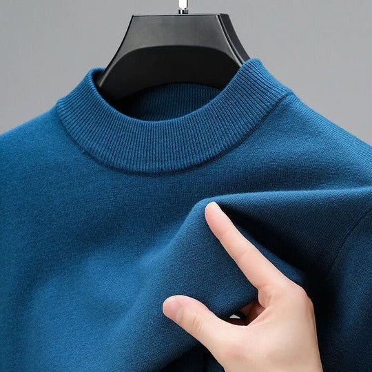Soft knit sweater pullover in blue with a regular fit and straight hem, front view.