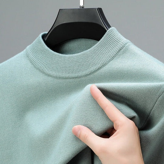 Soft knit sweater pullover in gray with a regular fit and straight hem, front view.