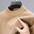 Soft knit sweater pullover in beige with a regular fit and straight hem, front view.