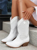 Cowboy boots in white with a mid-calf shaft and side zip, side view.