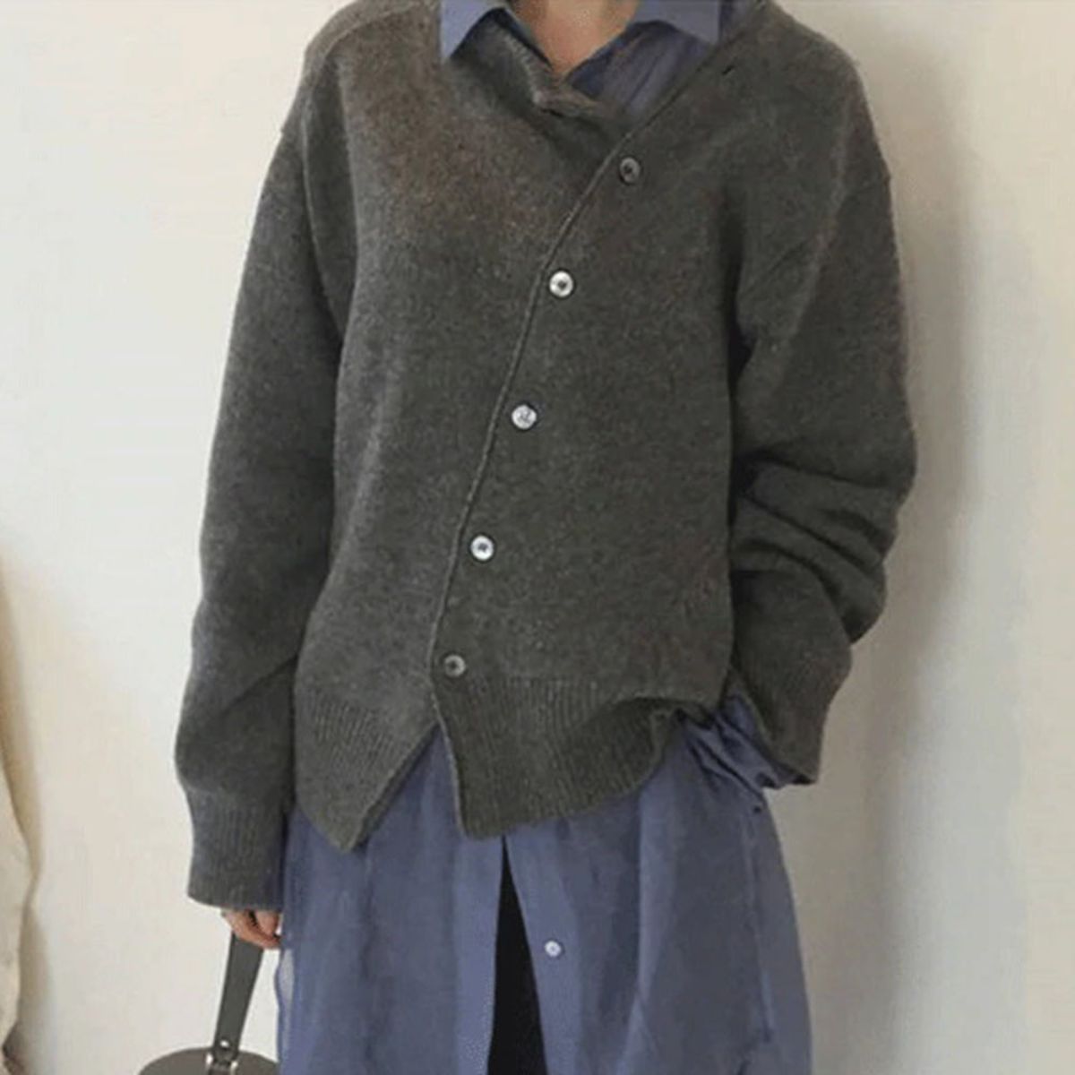 Soft knit sweater in grey, breathable pullover shown from the front.