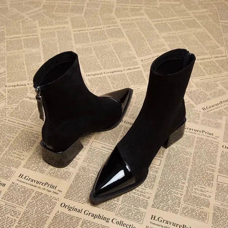 Suede-look ankle boots detail showing the mixed suede and patent texture