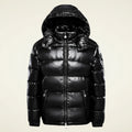 Glossy hooded quilted puffer jacket in black.