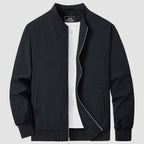 Bomber jacket windbreaker in Black, ribbed collar and cuffs with full zip front.
