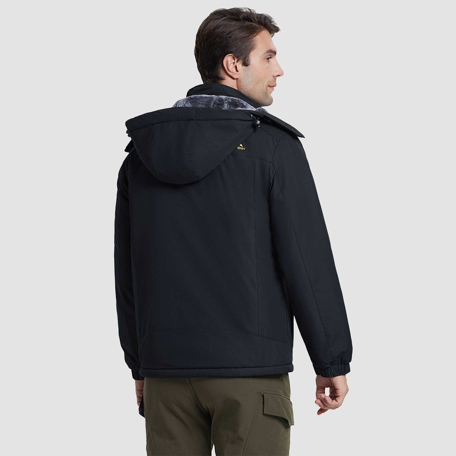 Water-resistant ski jacket worn outdoors