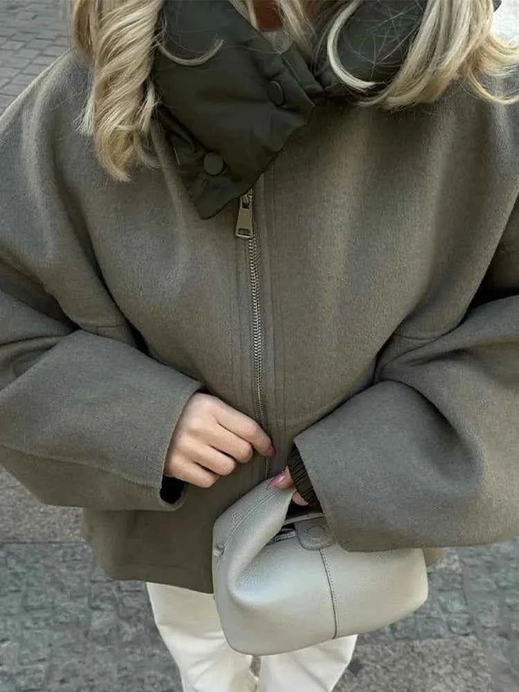 Olive quilted hooded jacket, side view showing mid length
