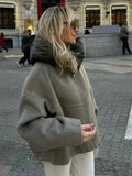 Olive quilted jacket with oversized fit and hood, front view
