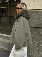 Olive quilted jacket with concealed zip closure, styled view