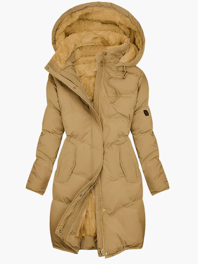 Green padded quilted coat detail showing soft-lined hood and front zip