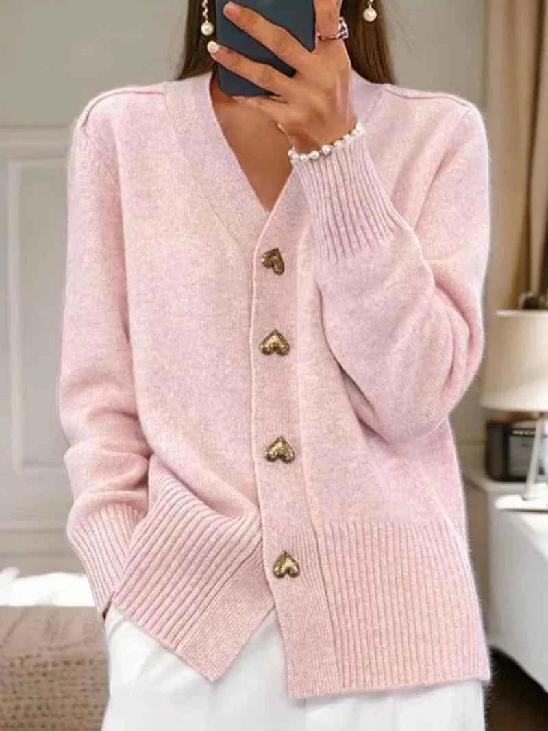 Light pink minimalist cardigan with buttoned front, straight cut