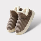 Plush cushioned slippers, close-up of the durable outdoor-ready sole