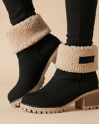 Orthopedic sherpa-cuff ankle boots in black.