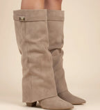 Pointed-toe slouch knee-high boots in beige.