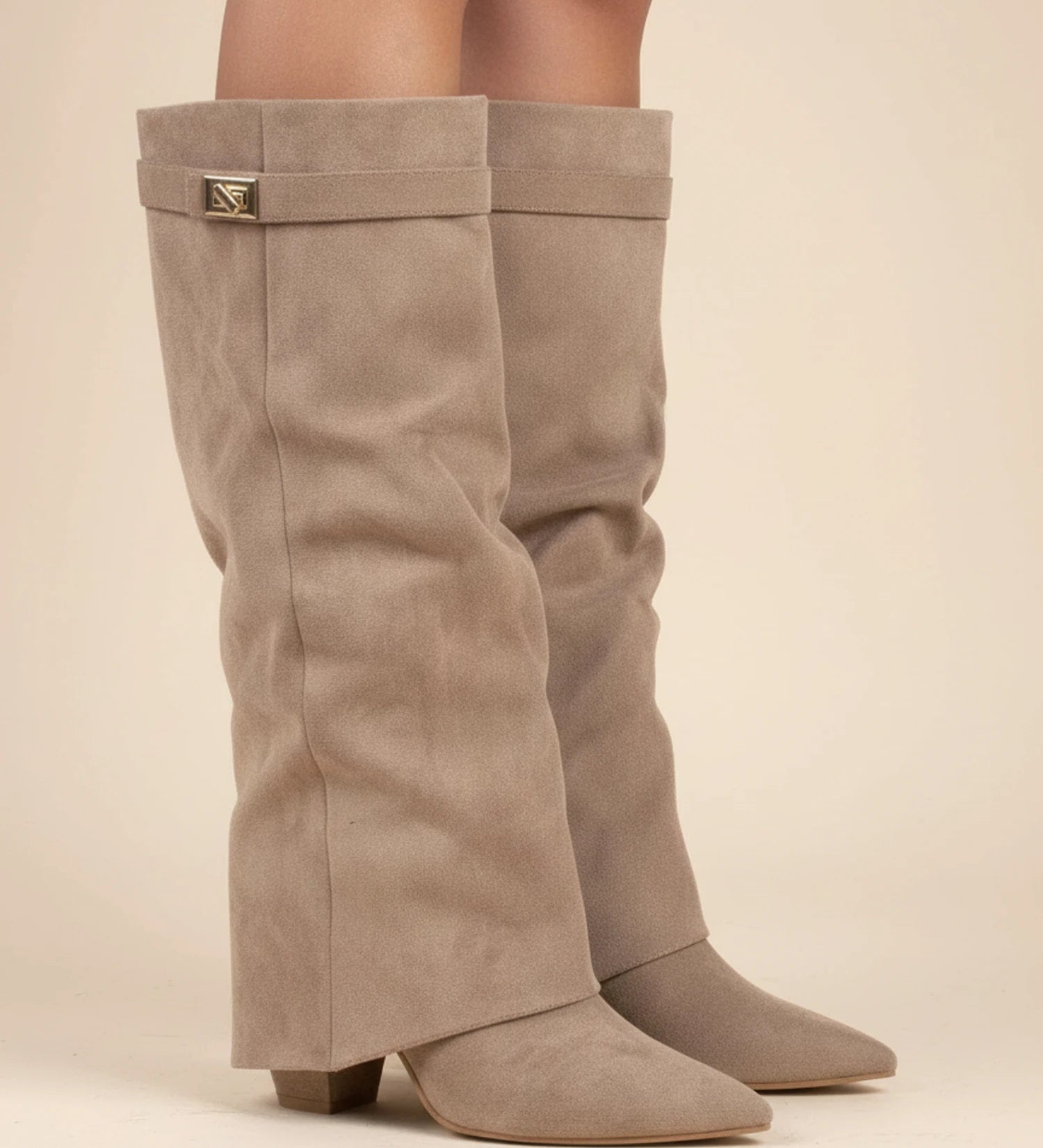 Pointed-toe slouch knee-high boots in beige.