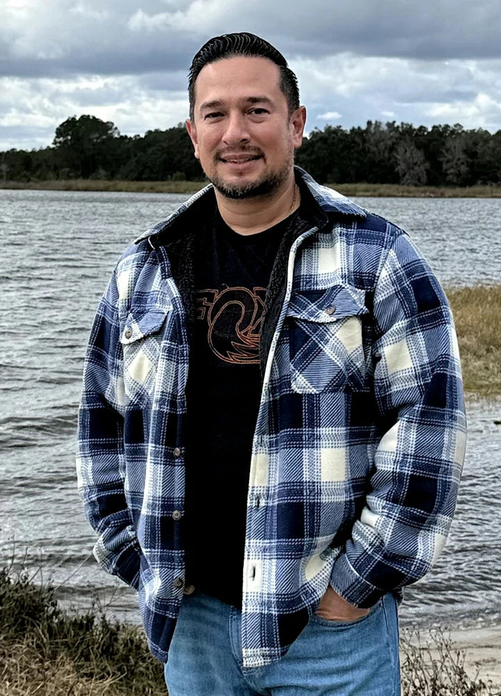 Plaid shirt jacket in Ocean Breeze Tartan, sherpa-lined with four pockets and button front.